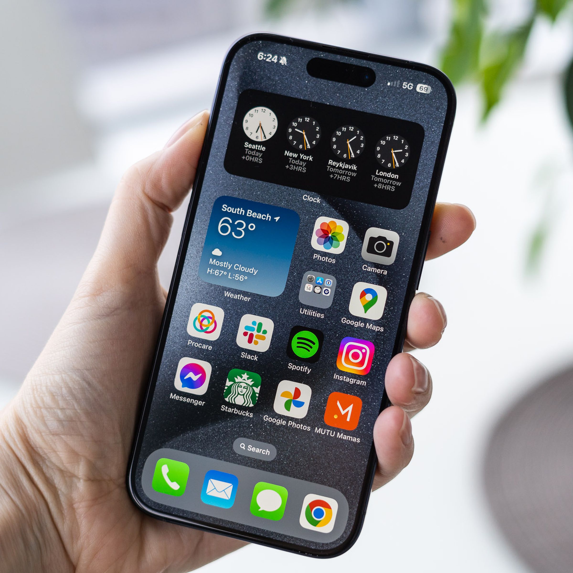 The iPhone 15 Pro in hand.