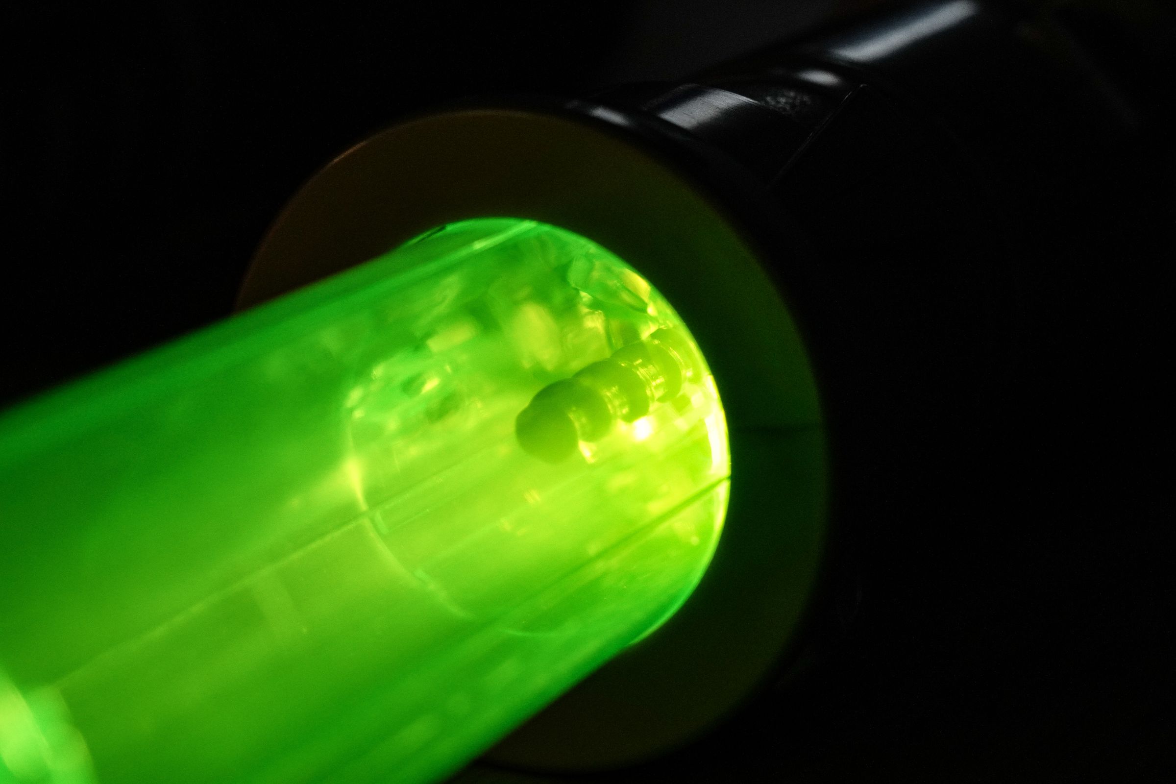 The screw is clearly visible through the transparent lightsaber shell — if you look down.